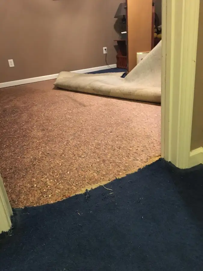Carpet pad removal revealing water damage during Drying & Dehumidification in Kaneohe